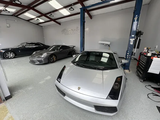 Luxury vehicles inside the Westway Auto Center collision repair facility